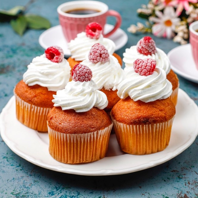 cupcakes whipped cream frozen raspberries