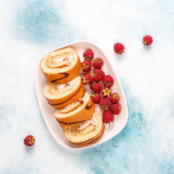 raspberry cake roll with fresh berries